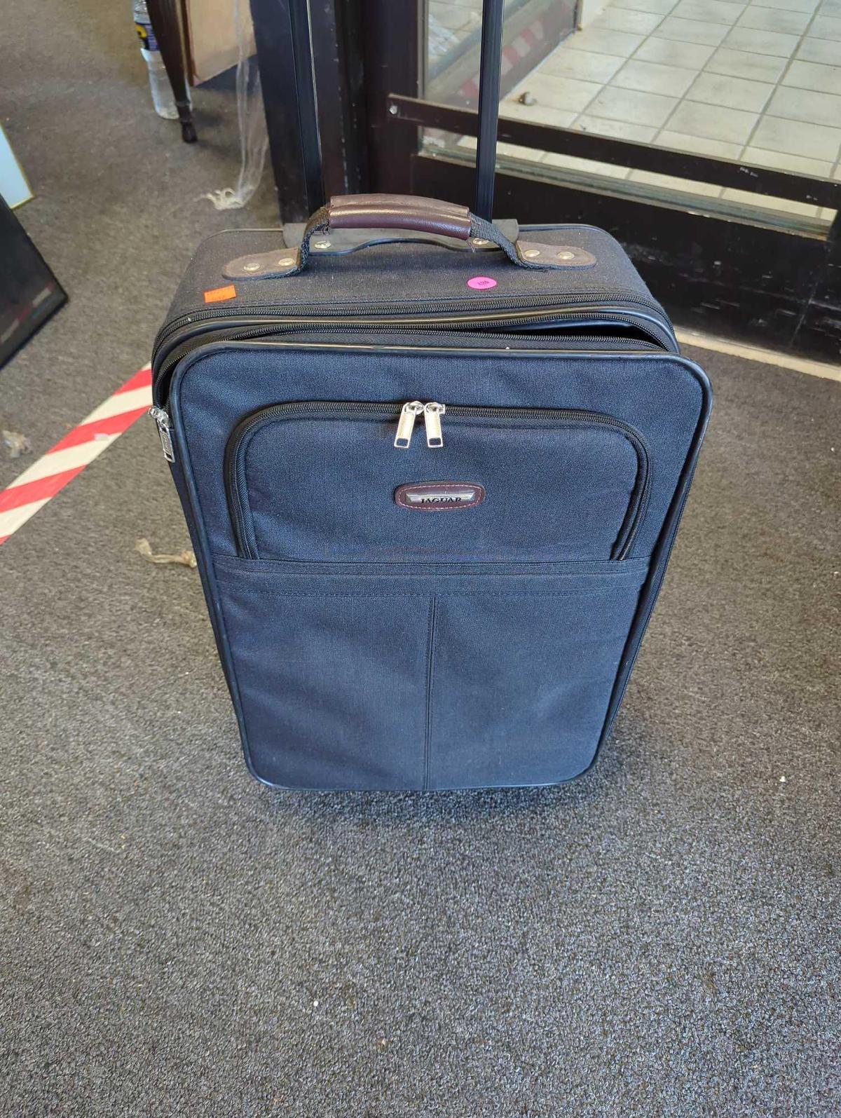 Jaguar Suitcase on Wheels and Has Pull Up Handle Is In Good Condition What you see in photos is what