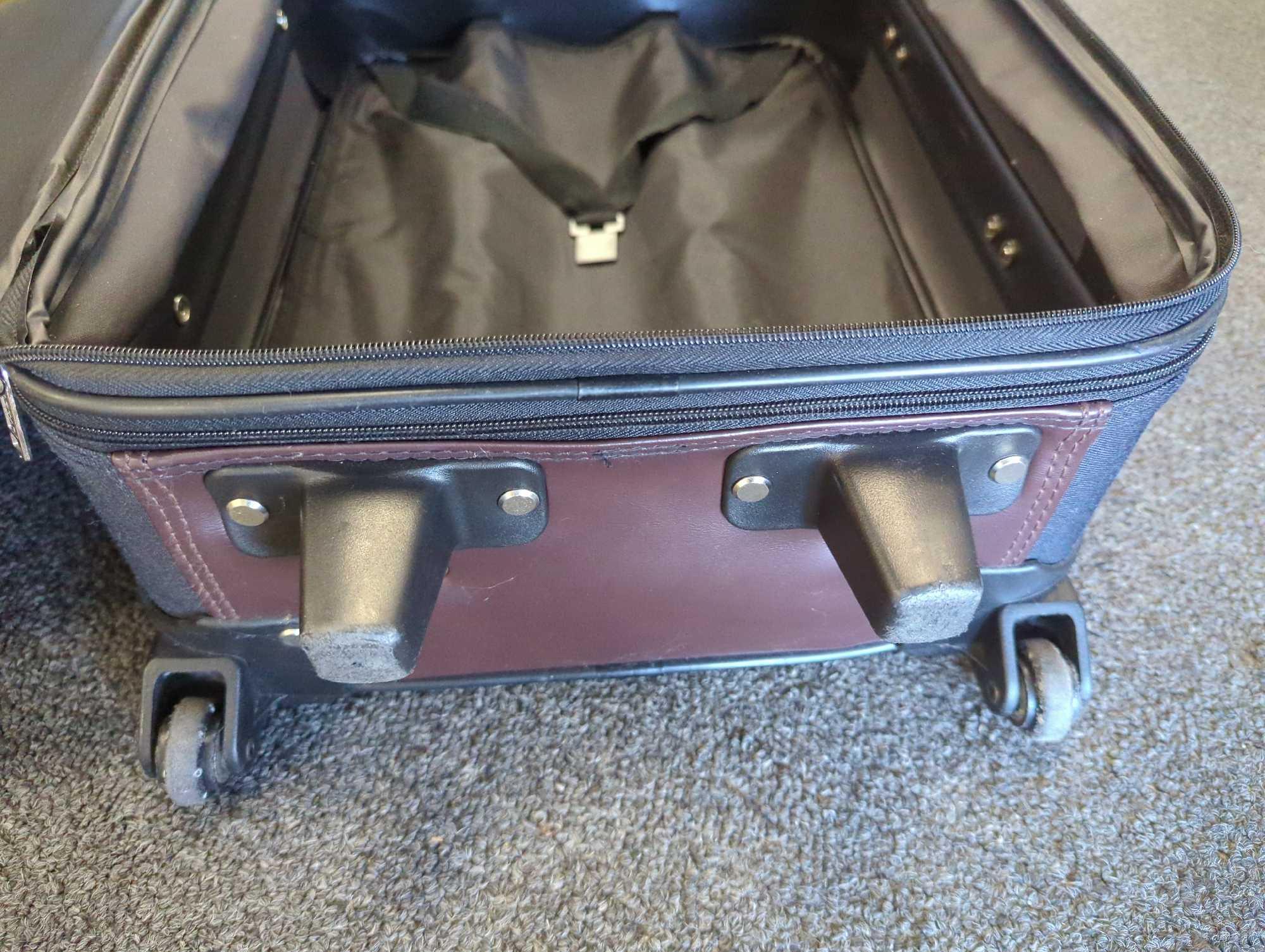 Jaguar Suitcase on Wheels and Has Pull Up Handle Is In Good Condition What you see in photos is what