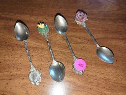 Lot of 4 Vintage silver plated Decorative spoons, 2 with decorative ceramic flowers. Comes as is