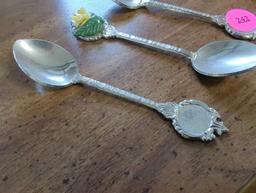 Lot of 4 Vintage silver plated Decorative spoons, 2 with decorative ceramic flowers. Comes as is