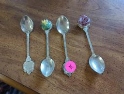 Lot of 4 Vintage silver plated Decorative spoons, 2 with decorative ceramic flowers. Comes as is