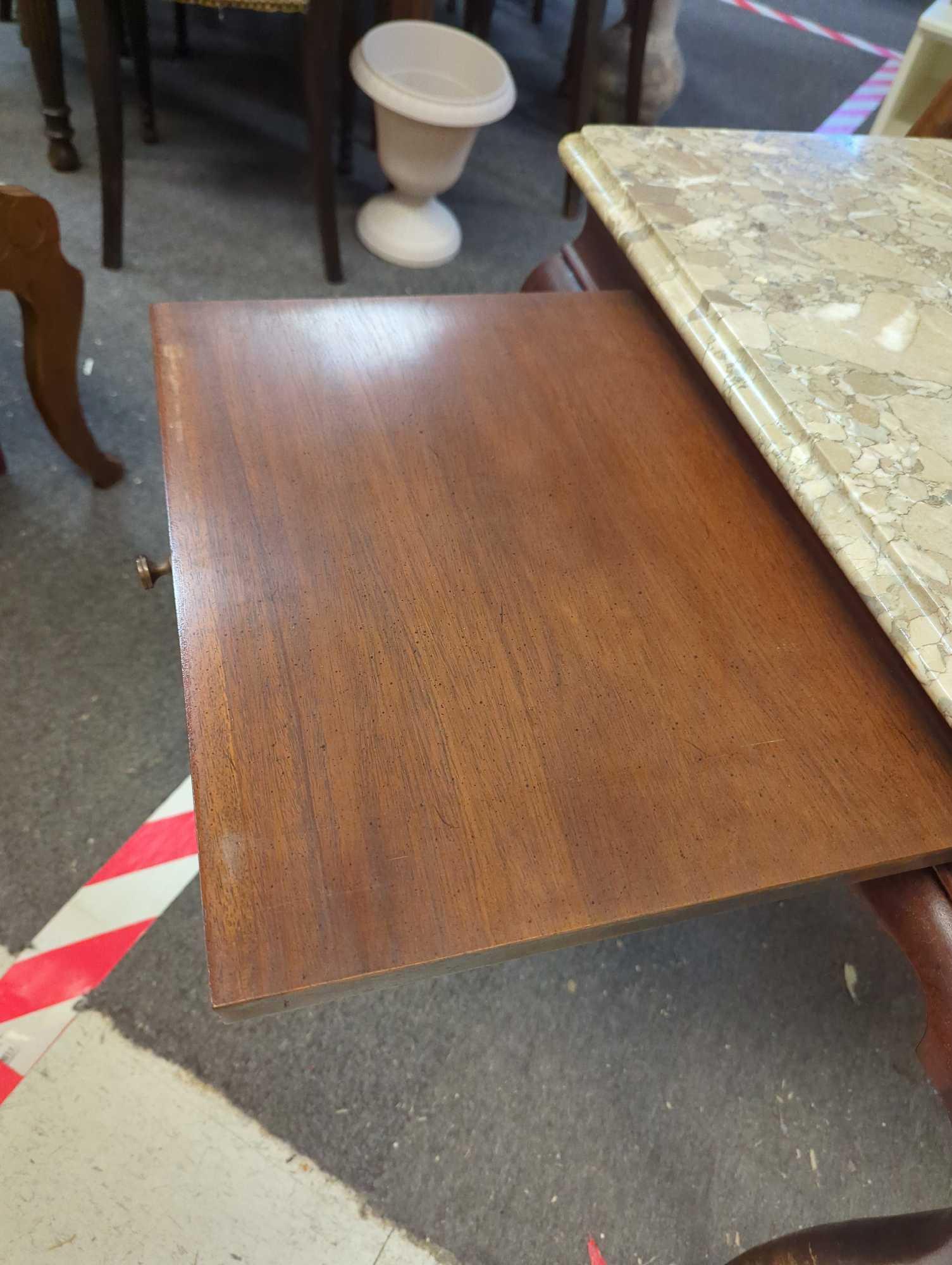 Marble top end table with extendable table top space drawer. Comes as a shown in photos. Appears to