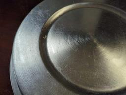 Set of 11 silver plastic charger plates. Comes as is shown in photos. Appears to be used.