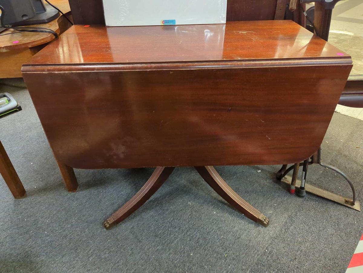 Antique claw foot drop leaf with drawer. Thumbs, as shown in photos. Appears to be missing 1 drawer.
