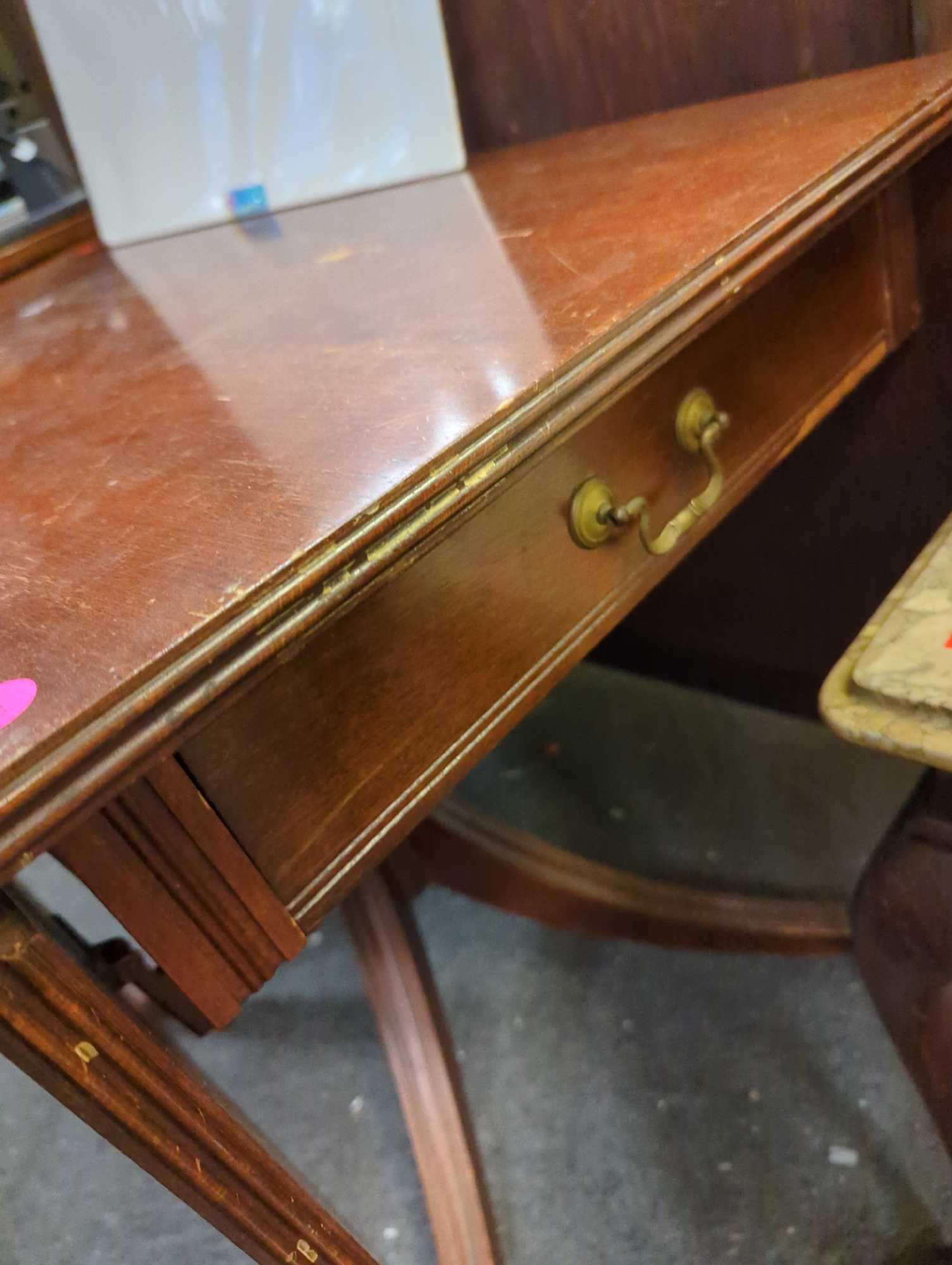 Antique claw foot drop leaf with drawer. Thumbs, as shown in photos. Appears to be missing 1 drawer.