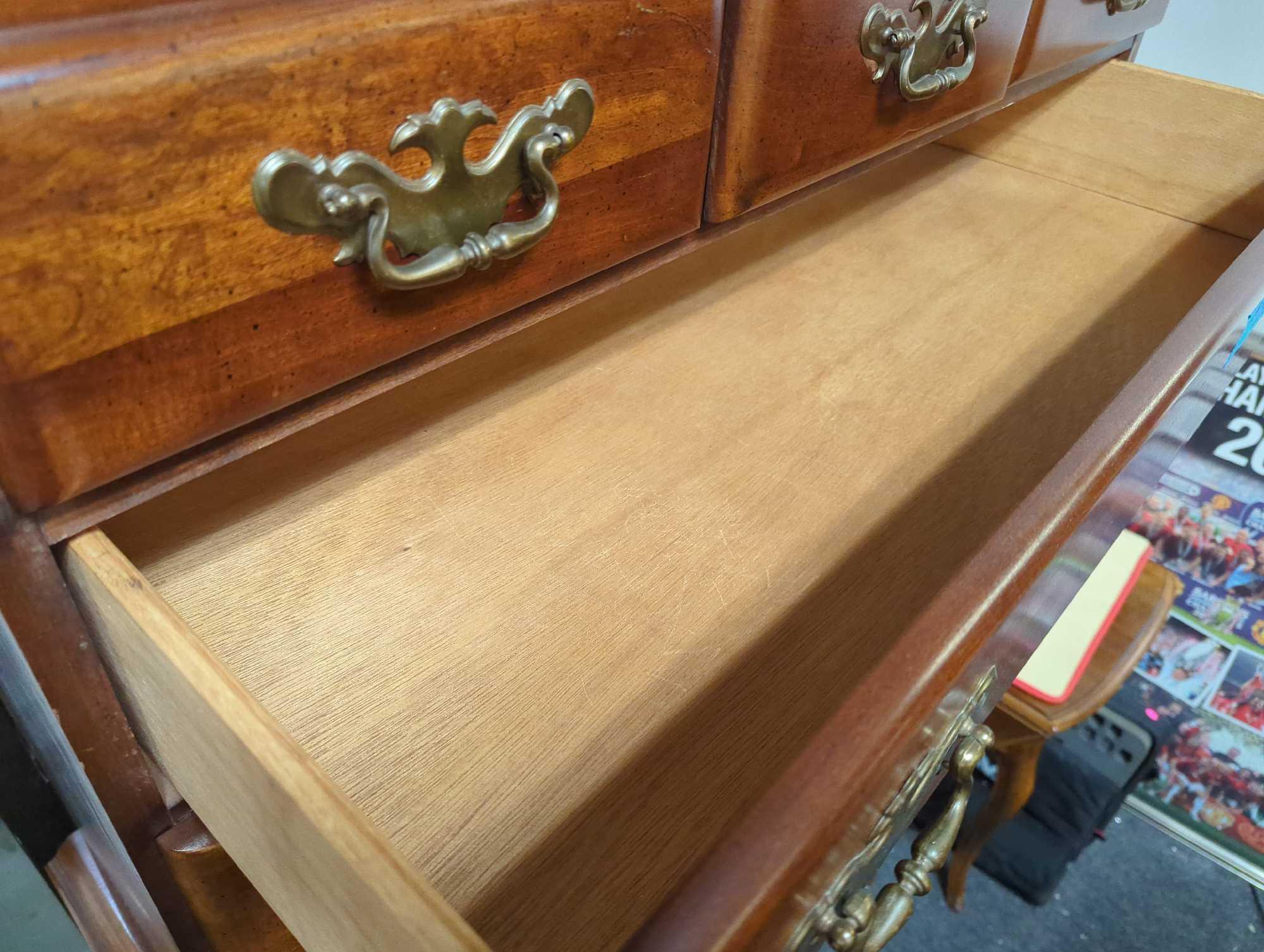 Vintage traditional wood highboy chest with 11 drawers. Comes as Shannon photos. Appears to be used.