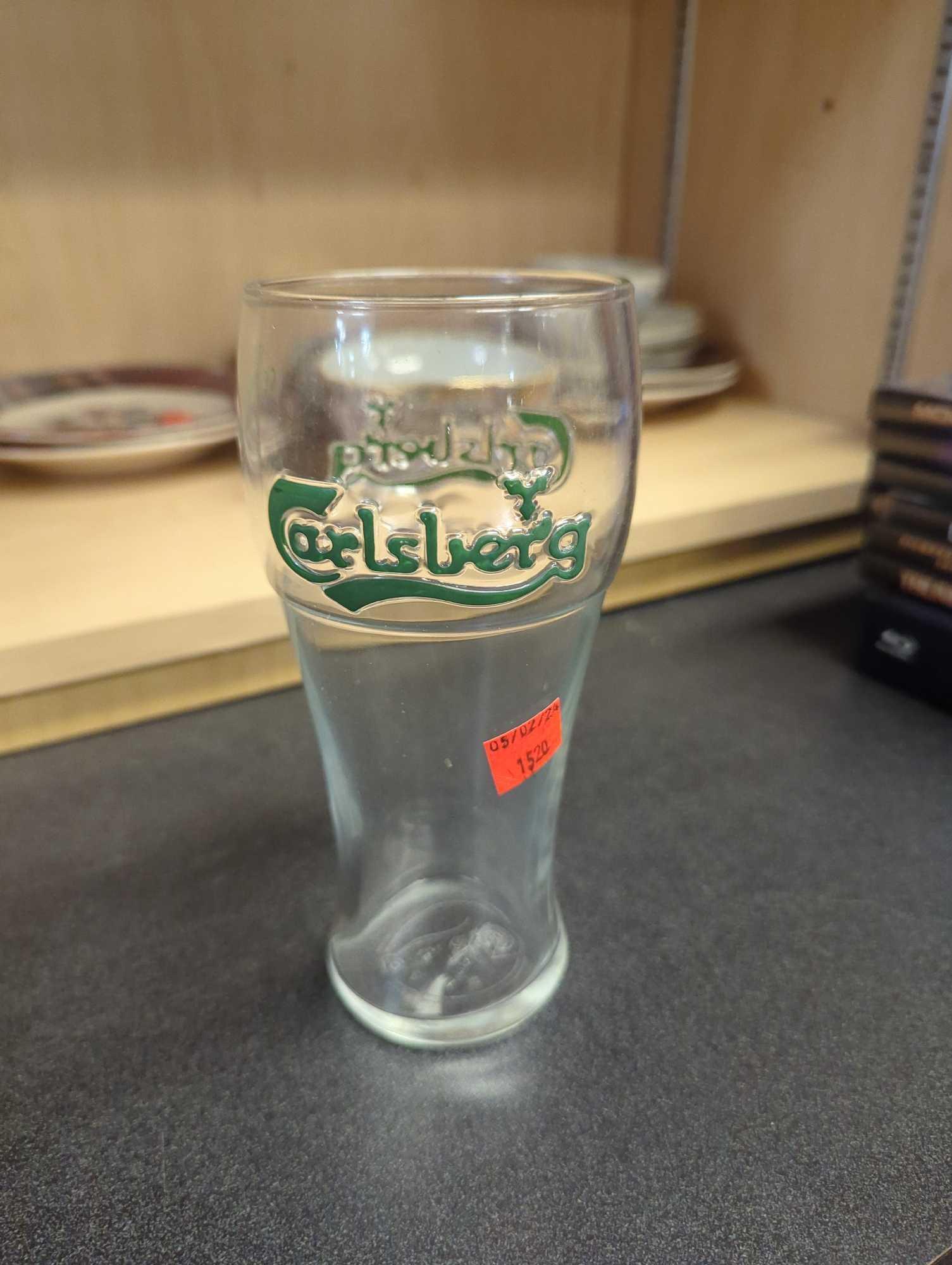 Shelf Lot of Assorted Glasses Including Wine Glasses, Beer Mugs, Tulip Glasses, Etc...What You See