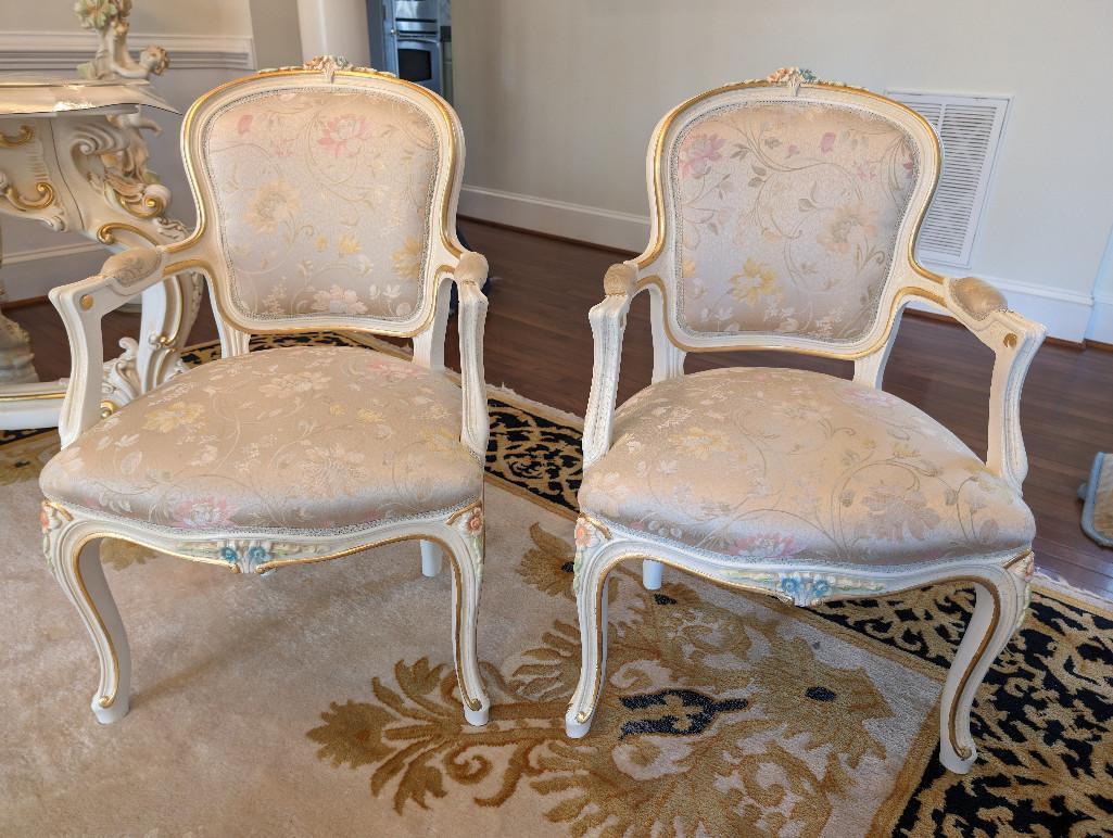 PAIR OF SILIK MINERVA ARM CHAIRS WITH NICE FLORAL CARVED DETAILING. THESE CHAIRS RETAIL FOR $4,800.