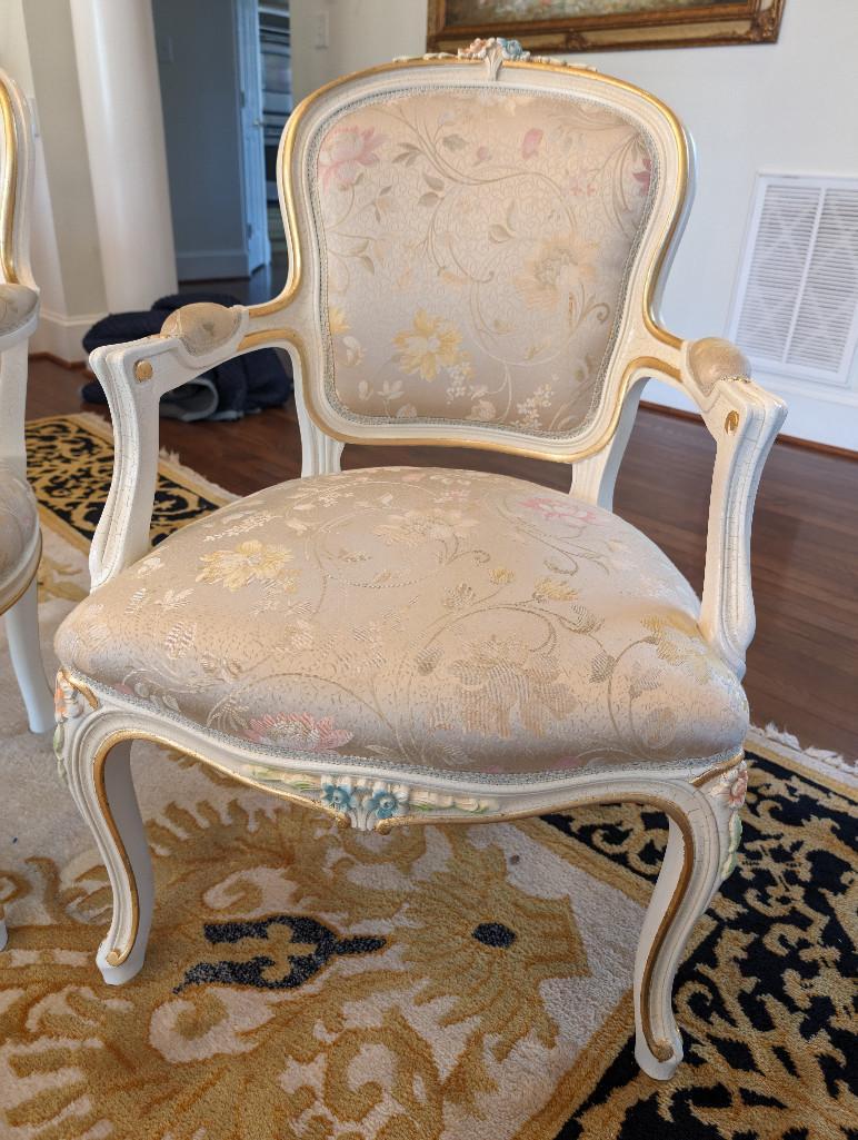 PAIR OF SILIK MINERVA ARM CHAIRS WITH NICE FLORAL CARVED DETAILING. THESE CHAIRS RETAIL FOR $4,800.