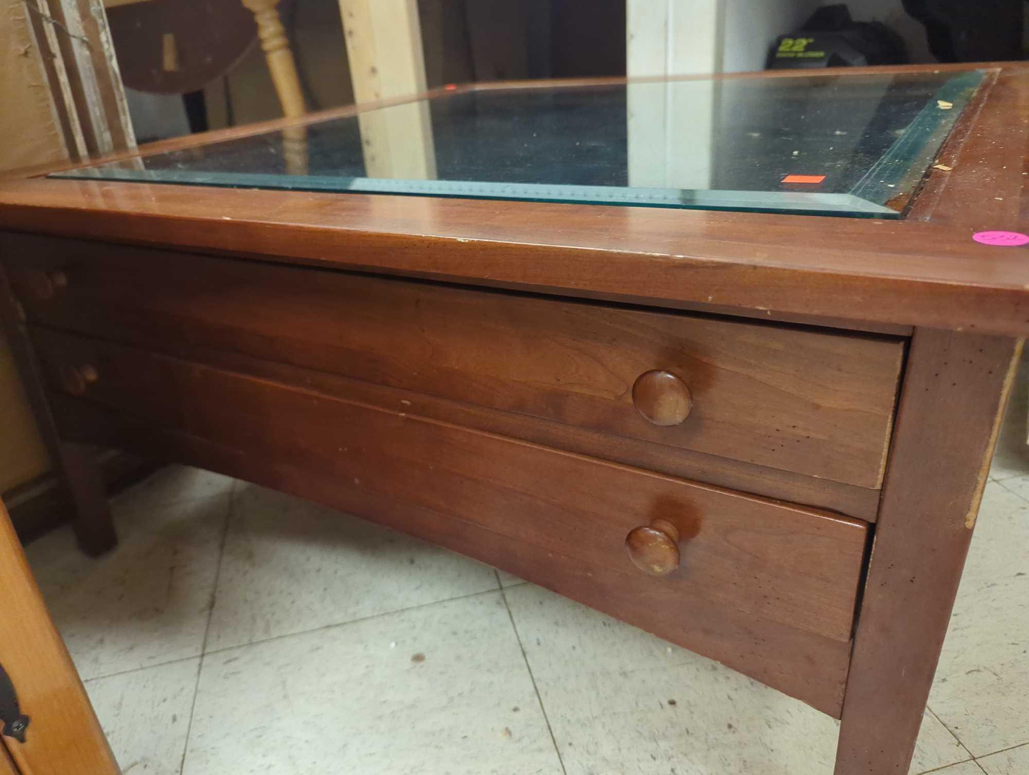 2 Drawer Display Coffee Table with Glass Top, Table Top has Some Damage, Approximate Dimensions -