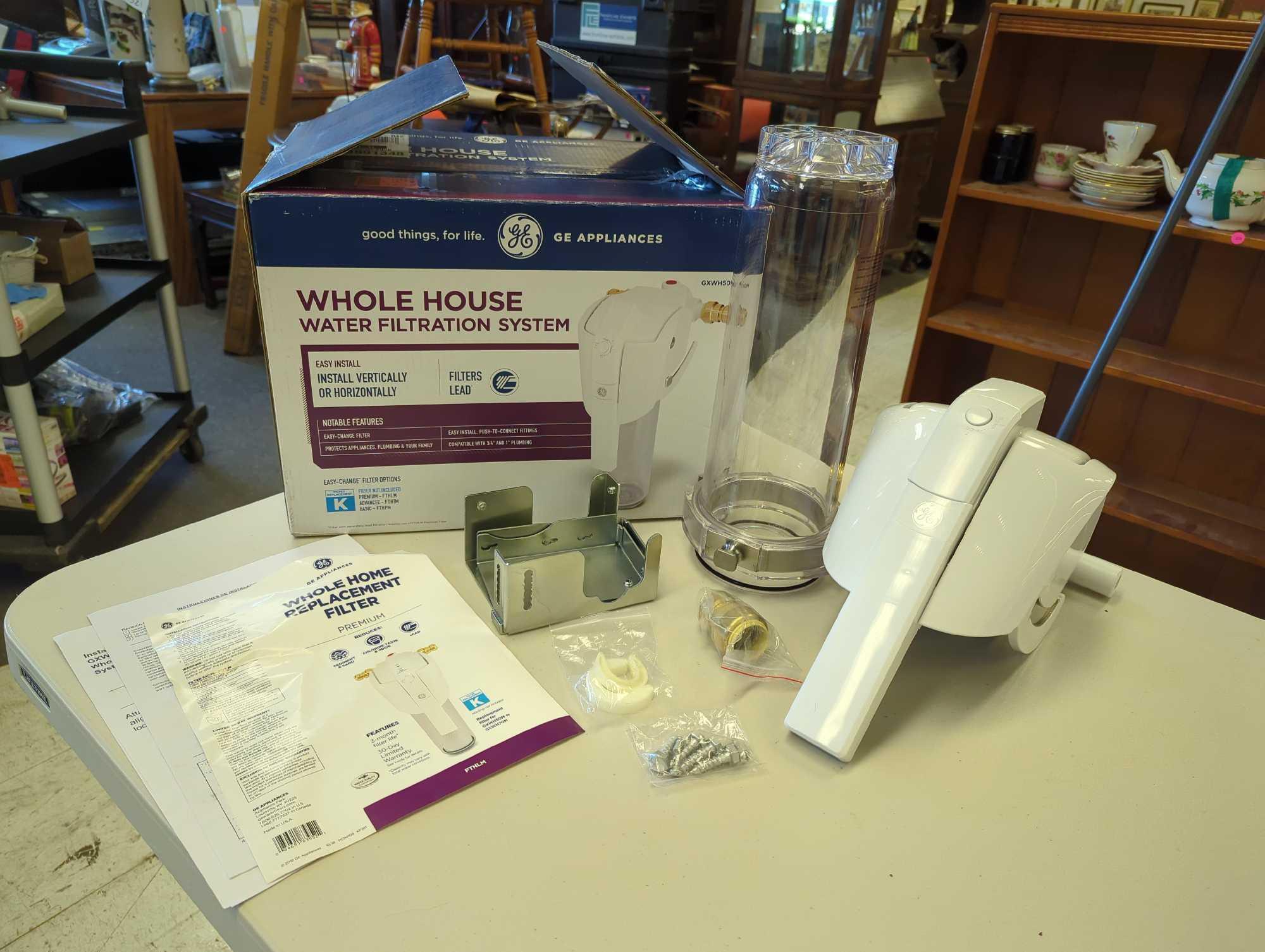 GE Whole House Water Filtration System. Comes in open box as is shown in photos. Appears to be new.