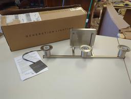 Generation Lighting Brut 3-Light Brushed Nickel Bathroom Vanity Light. Comes as is shown in photos.