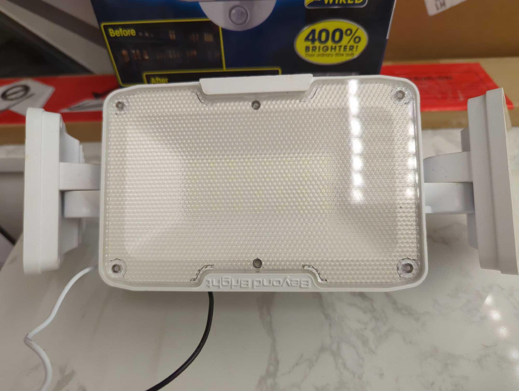 BEYOND BRIGHT Hardwired Black Motion Sensing LED Landscape Flood Light. Comes in open box as is