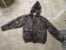 (LR) REMINGTON CLOTHING CAMO ZIP UP WINDBREAKER, SIZE MEDIUM. LIGHTLY USED CONDITION.