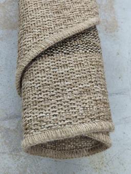 Rolled Woven Area Rug in Neutral Tones