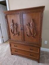 Two-Piece Wooden Armoire with Carved Detailing and Storage Drawers