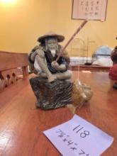 Ceramic Fisherman Figure with Fishing Rod and Basket, 7x4x7 Inches