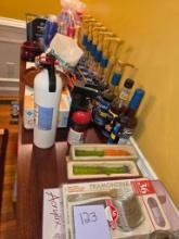 Contents of Table Including Culinary Tools, Utensils, and Syrups
