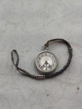 Silver Pocket Watch with Missing Glass and Worn Strap