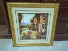 Framed Artwork of a Seaside Cottage Scene with Gold-Tone Frame