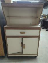 Wood-Laminate Cabinet with Upper Shelf, Drawer, and Doors on Casters