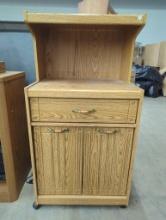 Wooden Storage Cabinet With Drawer, Shelves, and Casters