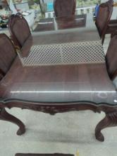 Ornate Dining Table With Glass Top and Carved Wood Base