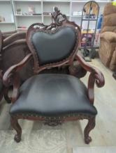 Ornate Wooden Armchair with Black Upholstery, Approx. 27 x 23 x 43.5 Inches