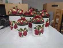 Five Ceramic Canisters With Red and Green Apple Lids