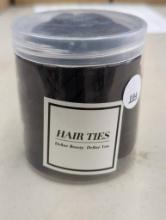 Container of Hair Ties with Label Define Beauty. Define You.