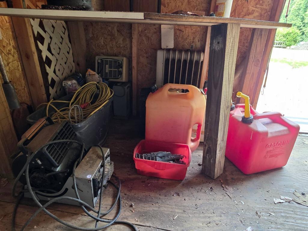 PowerCraft Equipment, Cables, Gas Cans, and Miscellaneous Contents Under Table