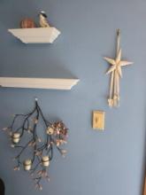 Contents on Wall Including Decorative Star, Branch Candle Holder, Ceramic Dog, and Ornamental Sph...