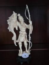 Plastic Figurine of a Fisherman With Fish, 6 1/2H