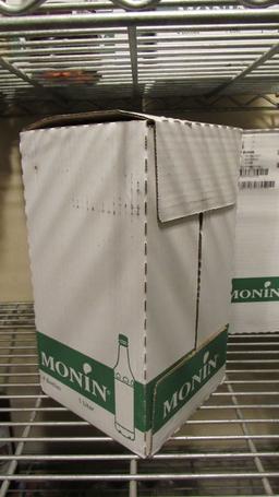 8) BOTTLES OF MONIN CARAMEL GOURMET SYRUP.