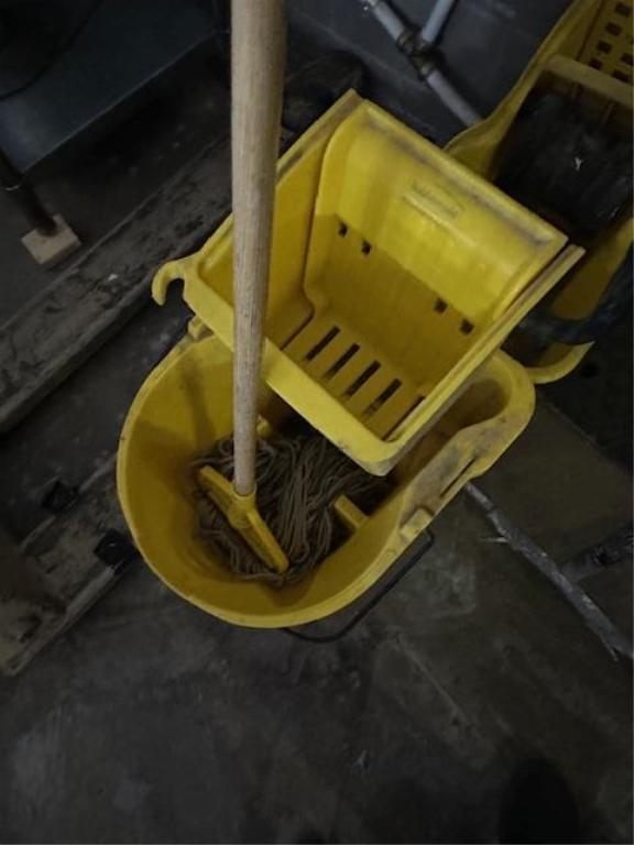 2) YELLOW MOP BUCKET AND MOP.