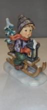 M.I. HUMMEL FIGURINE "RIDING INTO CHRISTMAS"