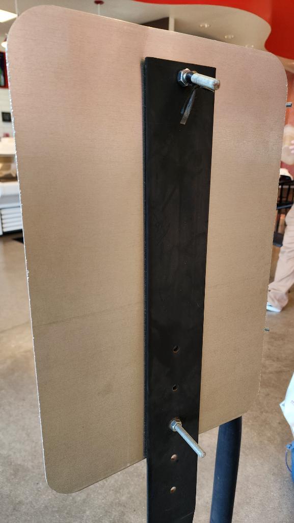 Two Sign Bases w/ Curbside Signs (Logos Covered w/ Tape)