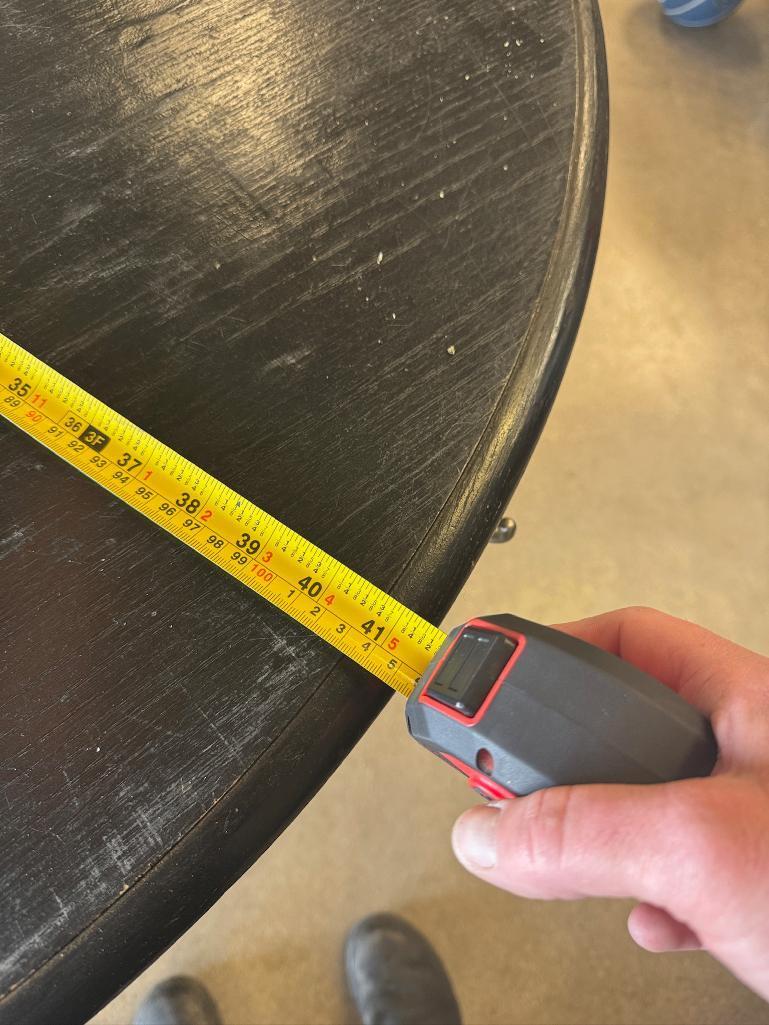 Used Large Black Round Retail Display Table