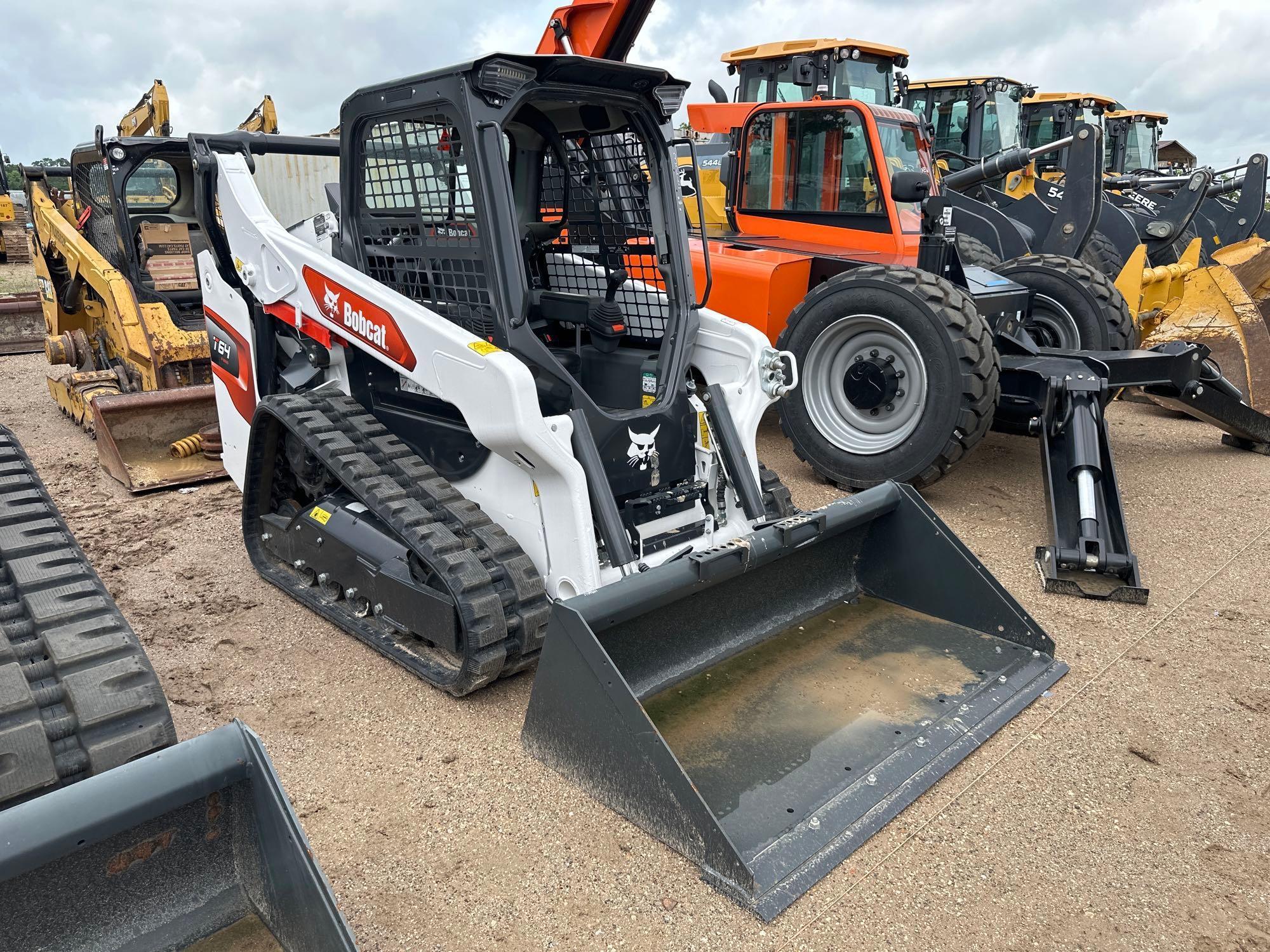 2023 BOBCAT T64 RUBBER TRACKED SKID STEER powered by diesel engine, equipped with rollcage,