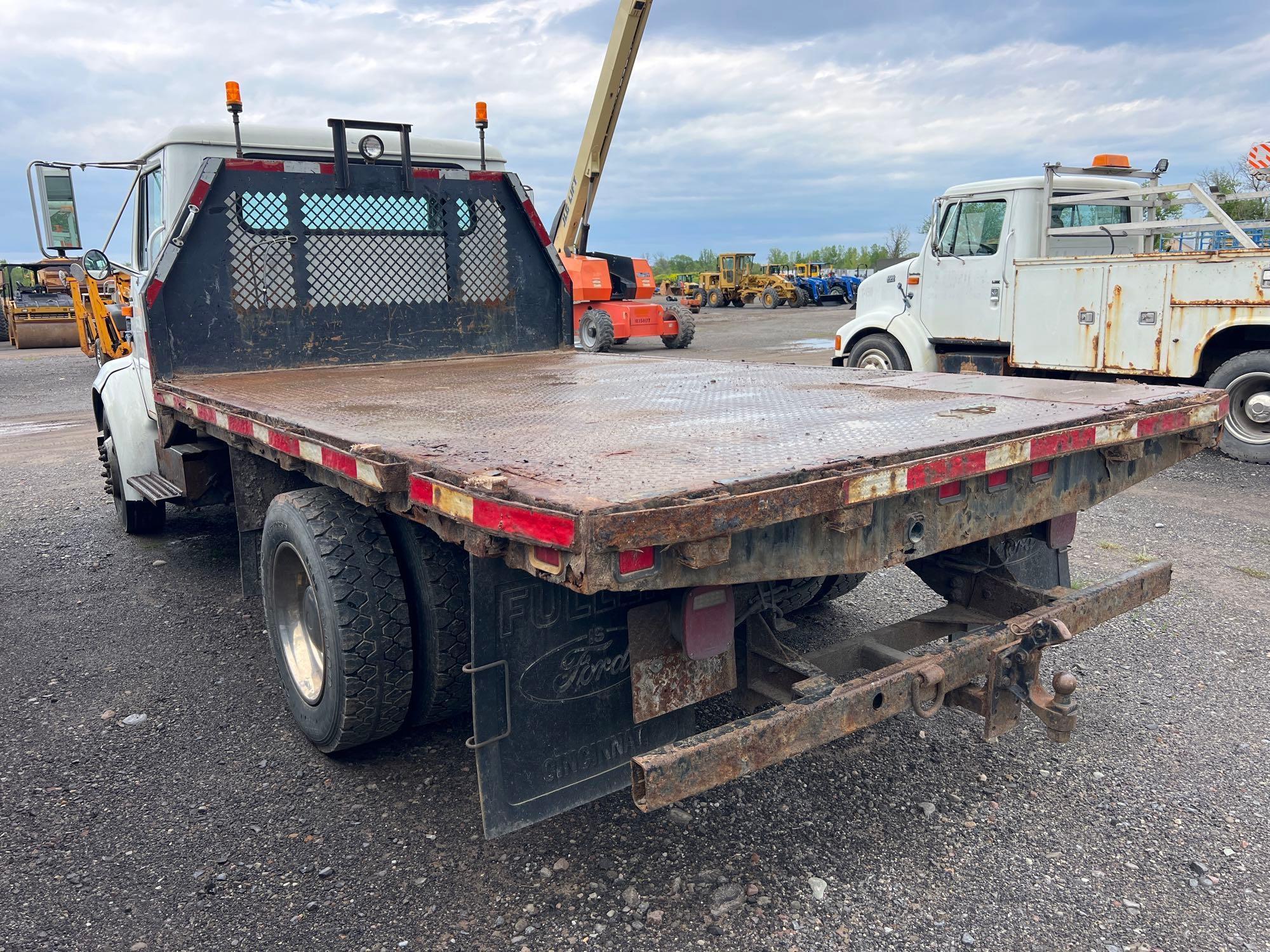 1999 INTERNATIONAL 4700 FLATBED TRUCK VN:1HTSMABM3XH646490 powered by T444E diesel engine, equipped