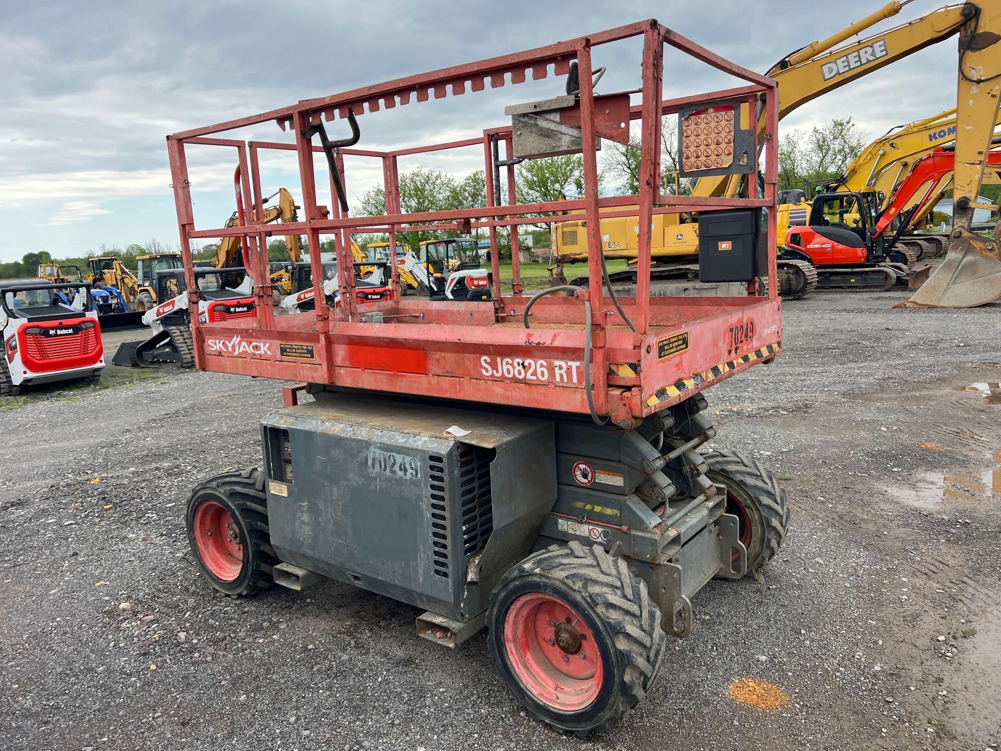 SKYJACK SJ6826RT SCISSOR LIFT SN-003883... ...4x4, powered by dual fuel engine, equipped with 26ft.