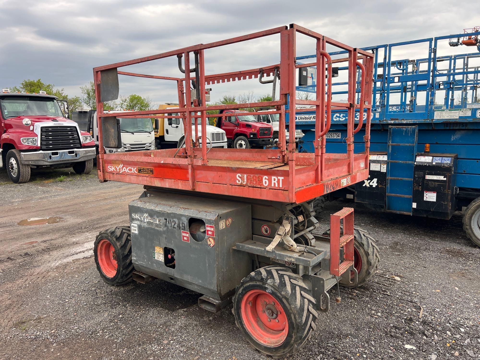 SKYJACK SJ6826RT SCISSOR LIFT SN-003883... ...4x4, powered by dual fuel engine, equipped with 26ft.