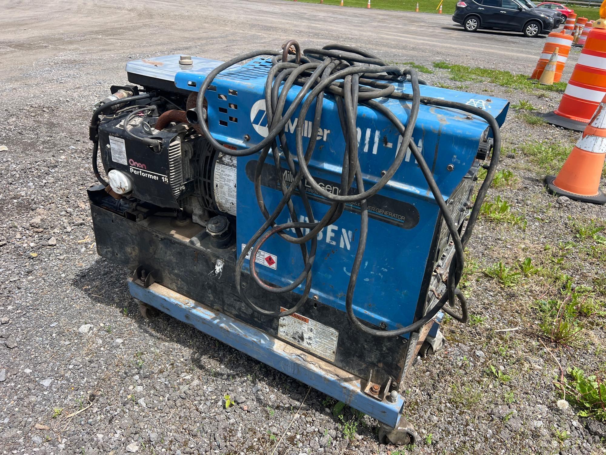 MILLER LEGEND WELDER powered by Onan performer gas engine. ...