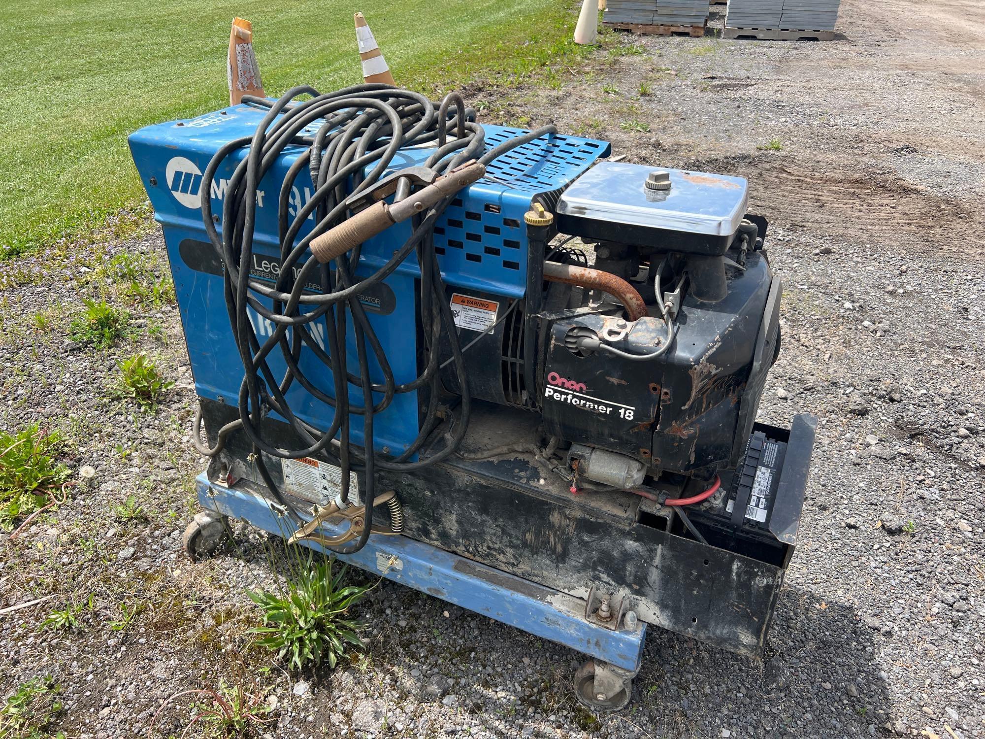 MILLER LEGEND WELDER powered by Onan performer gas engine. ...