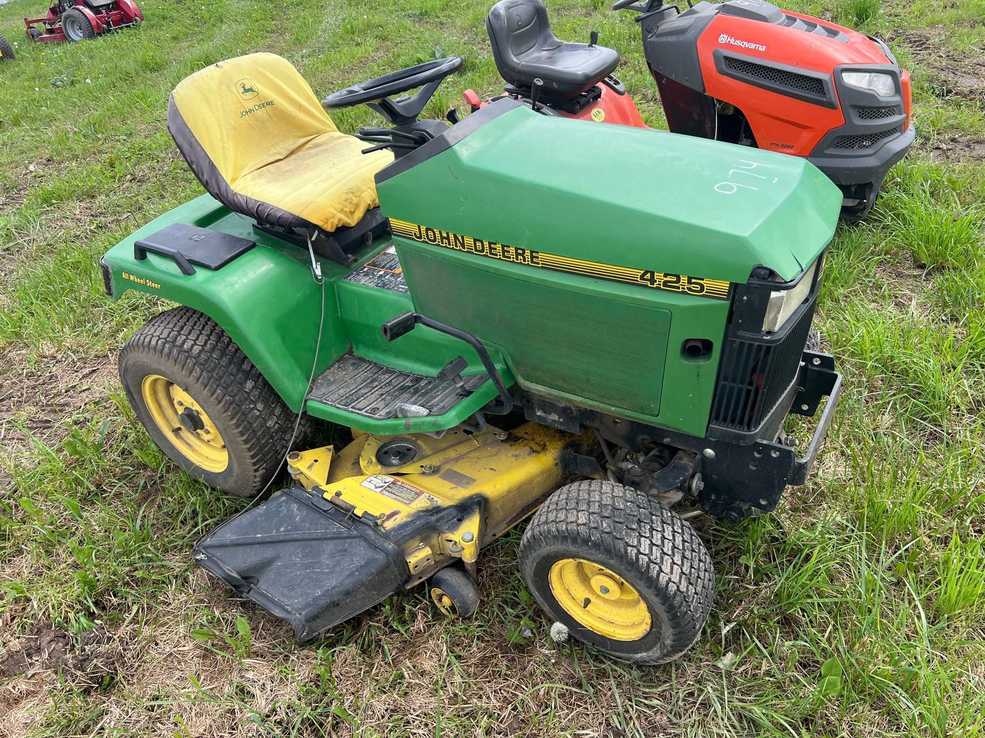 JOHN DEERE 425 LAWN & GARDEN TRACTOR powered by gas engine, equipped with 48in. Cutting deck.