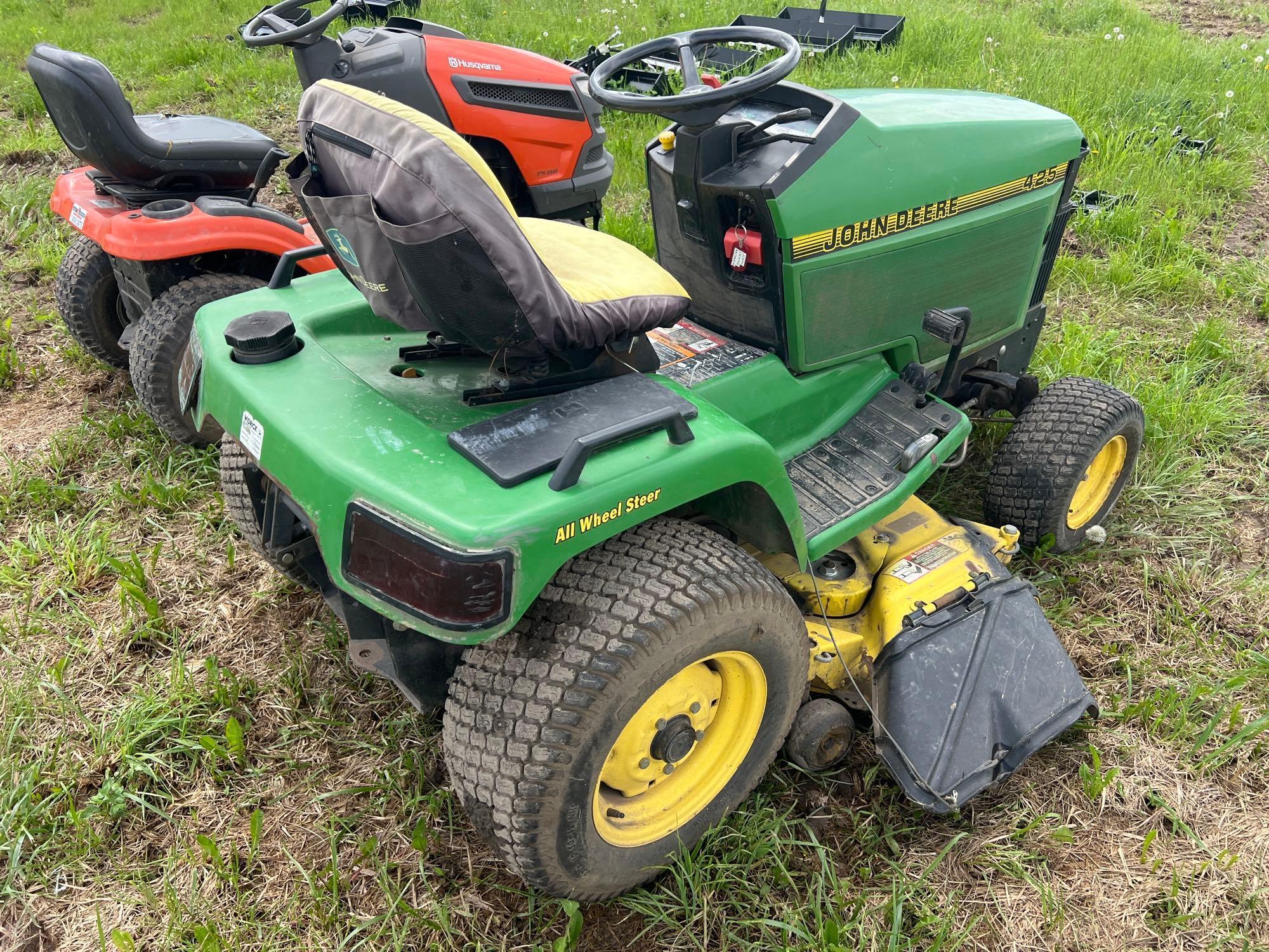 JOHN DEERE 425 LAWN & GARDEN TRACTOR powered by gas engine, equipped with 48in. Cutting deck.