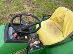 JOHN DEERE 425 LAWN & GARDEN TRACTOR powered by gas engine, equipped with 48in. Cutting deck.