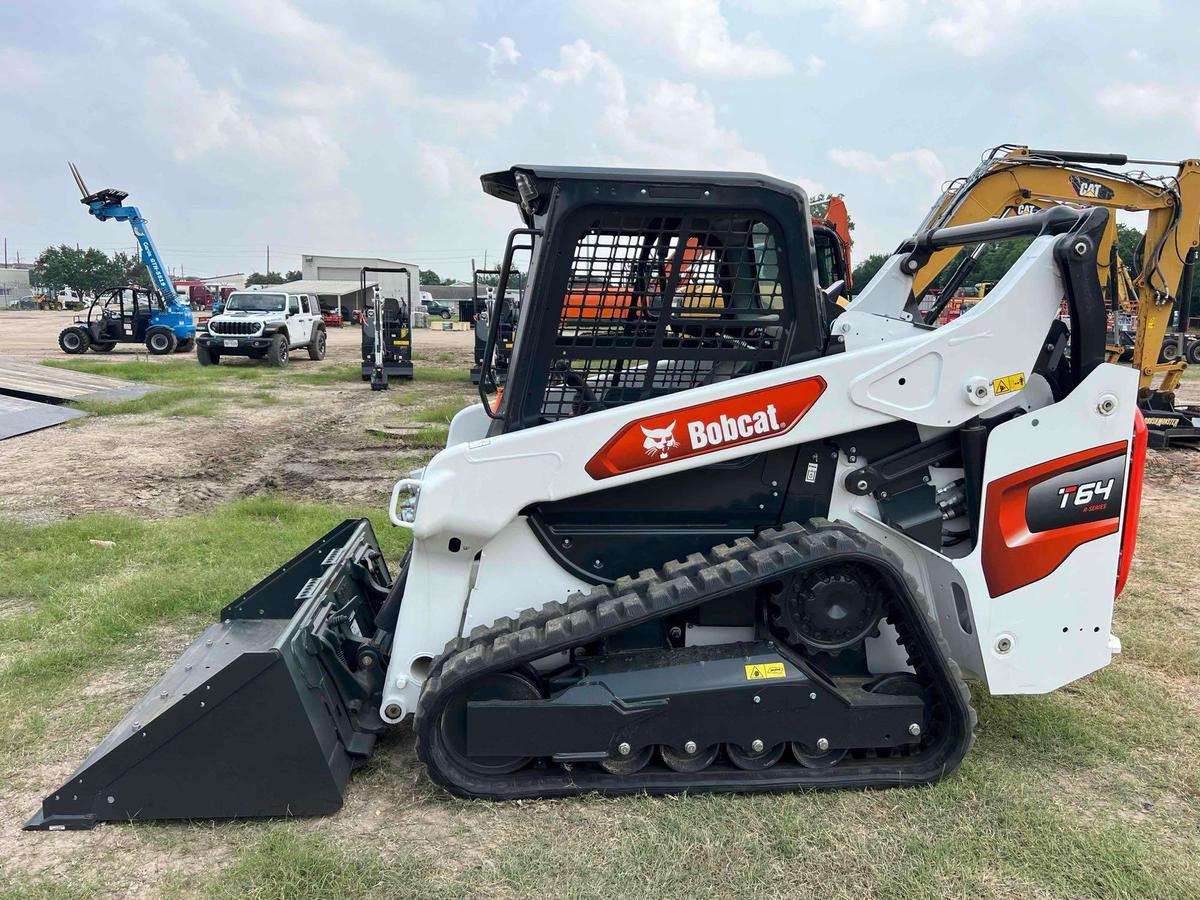 2023 BOBCAT T64 RUBBER TRACKED SKID STEER powered by diesel engine, equipped with rollcage,