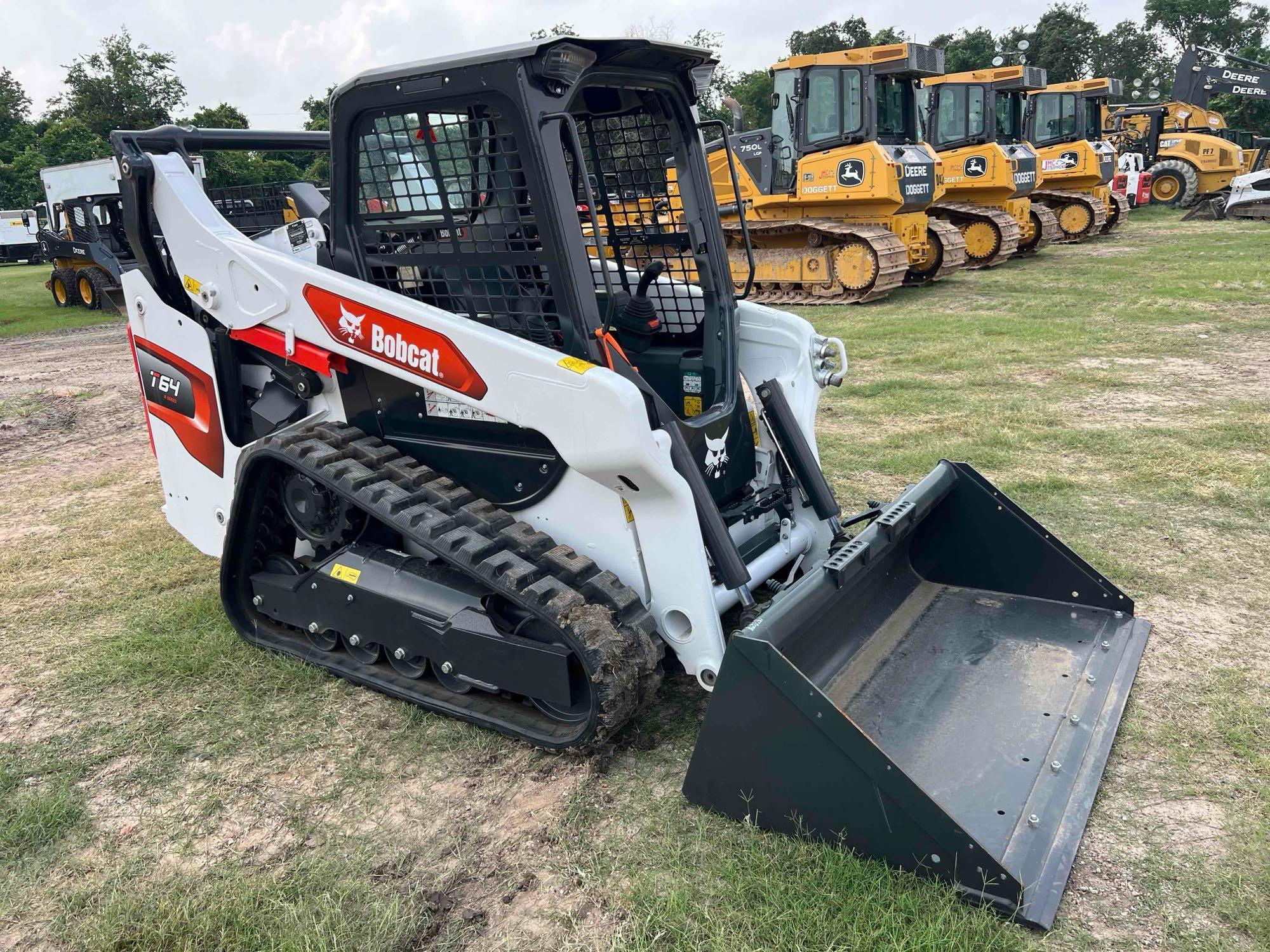 2023 BOBCAT T64 RUBBER TRACKED SKID STEER powered by diesel engine, equipped with rollcage,