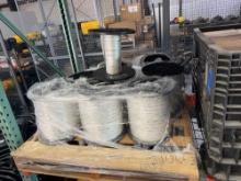 ROLLS OF MULE TAPE ON RACK SUPPORT EQUIPMENT